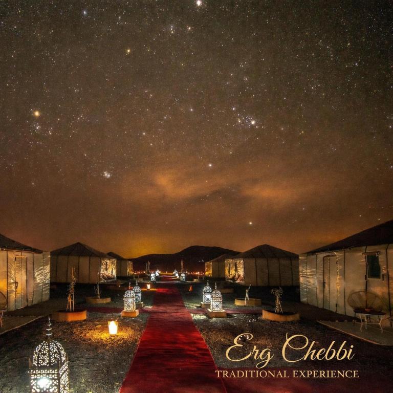 a starry sky at night with a red carpet at Erg Chebbi Traditional Experience & Activities in Merzouga