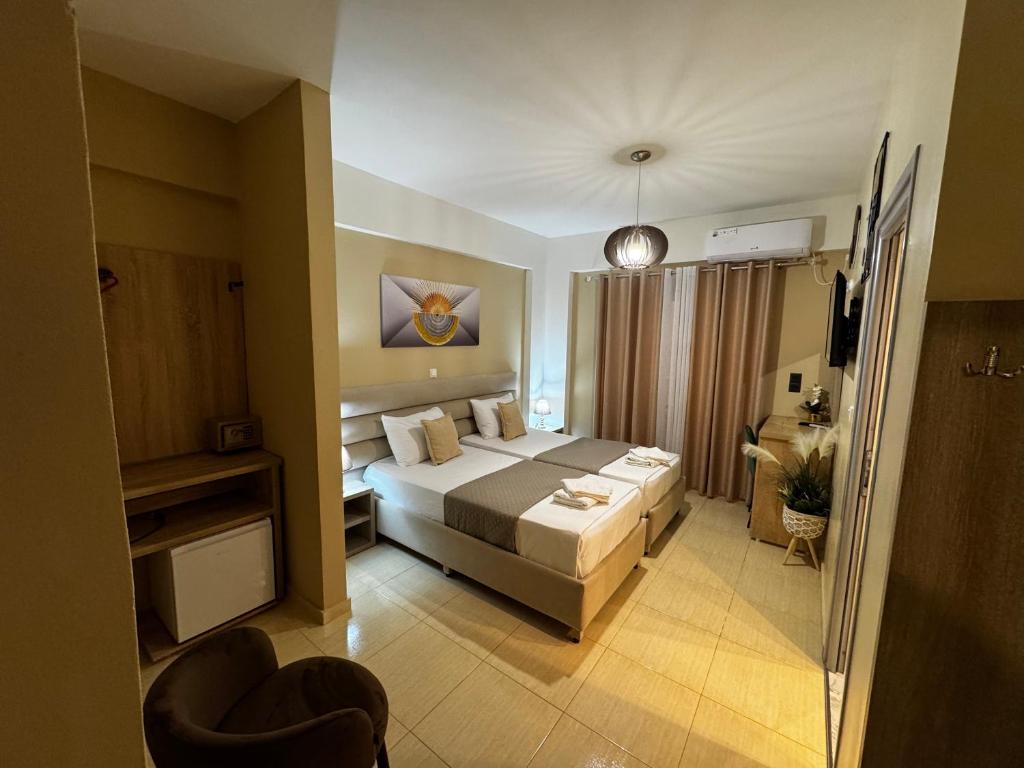 a bedroom with a large bed in a room at Hotel Driloni in Ksamil