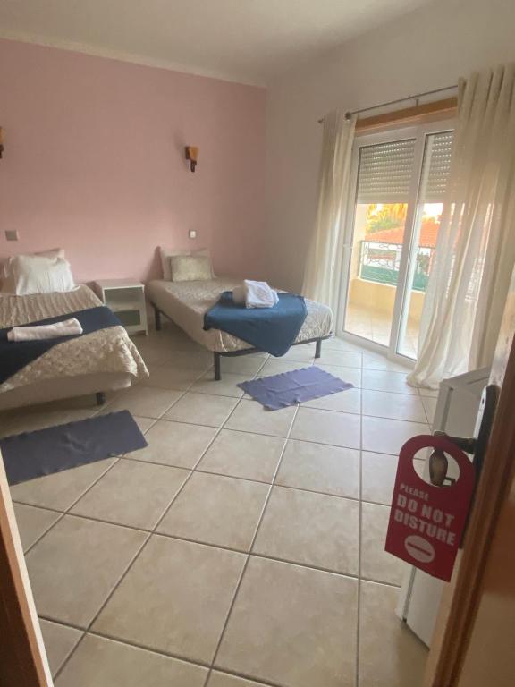 a living room with a couch and a table at Lagos Marina Guest House in Lagos