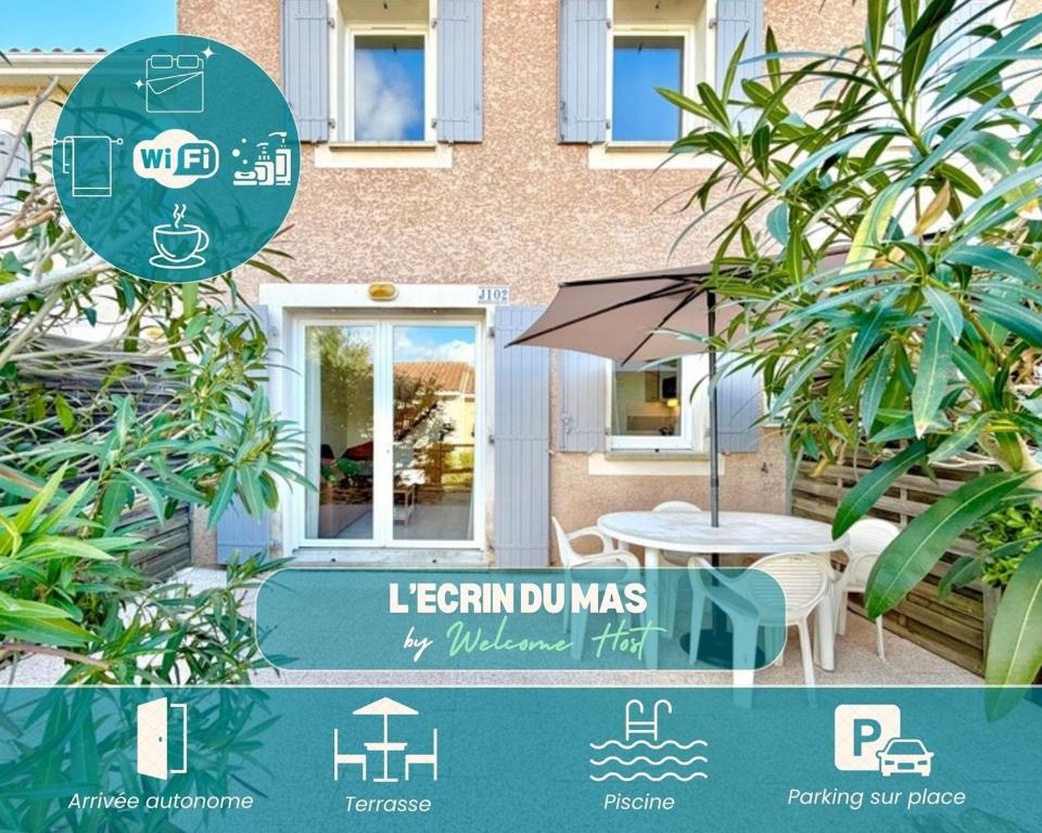 Ein Schild weist auf ein Gebäude mit einem Tisch und einem Sonnenschirm hin in der Unterkunft L’Écrin du Mas, 4 pers Piscine à Calvisson in Calvisson