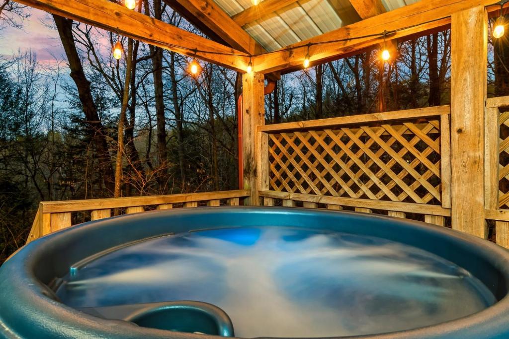 a hot tub in a gazebo with lights at Dog friendly, Hot Tub & Near Tuckaleechee Caverns in Townsend