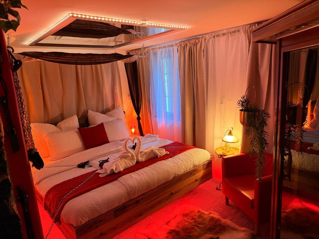 a bedroom with a bed with two shoes on it at Apartmán Mair Pardubice in Pardubice
