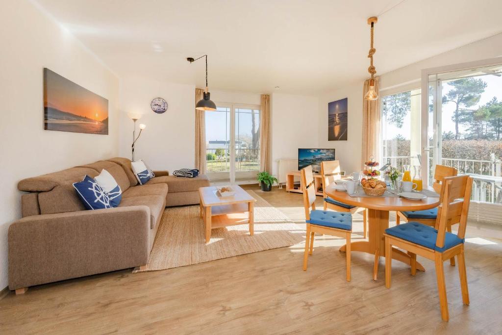 a living room with a couch and a table at Haus Strandoase 04 in Bansin