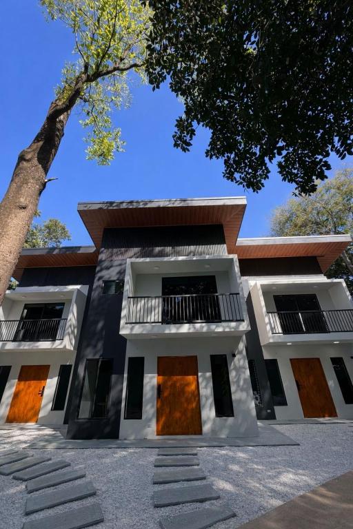 a building with a tree in front of it at Stillness Suite - Tamarindo - Pinilla - Avellanas - Pool - BBQ in San José Pinilla