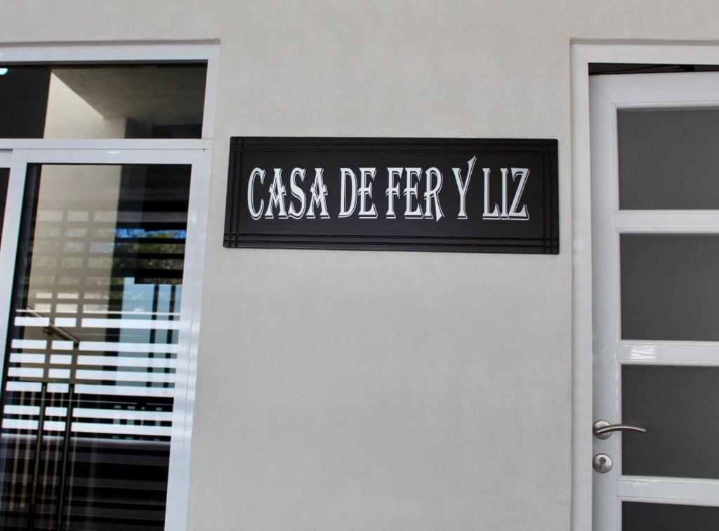 a sign on a wall next to a door at CASA LIZ & FER in Zacatlán
