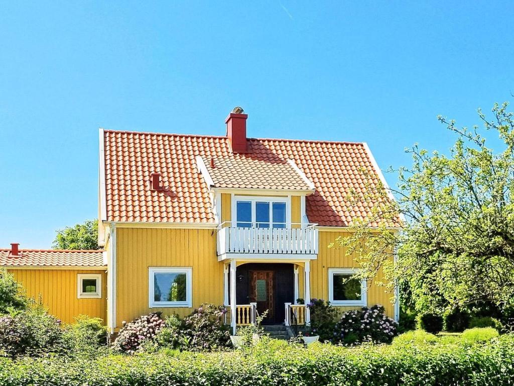 a yellow house with a red roof at 8 person holiday home in Moheda-By Traum in Moheda