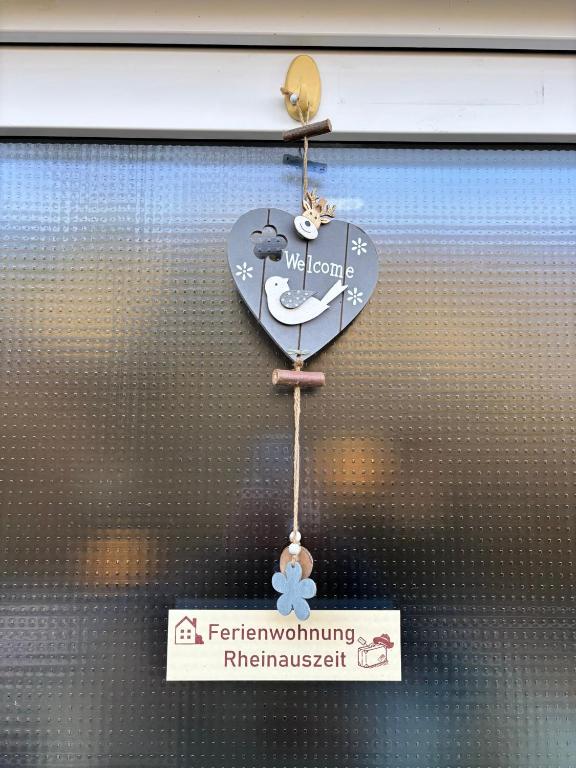 a heart shaped sign on a glass window at Rheinauszeit in Rheinbrohl