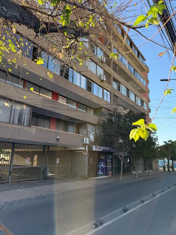 an empty street in front of a building at Hermoso Depto Almarza in Rancagua