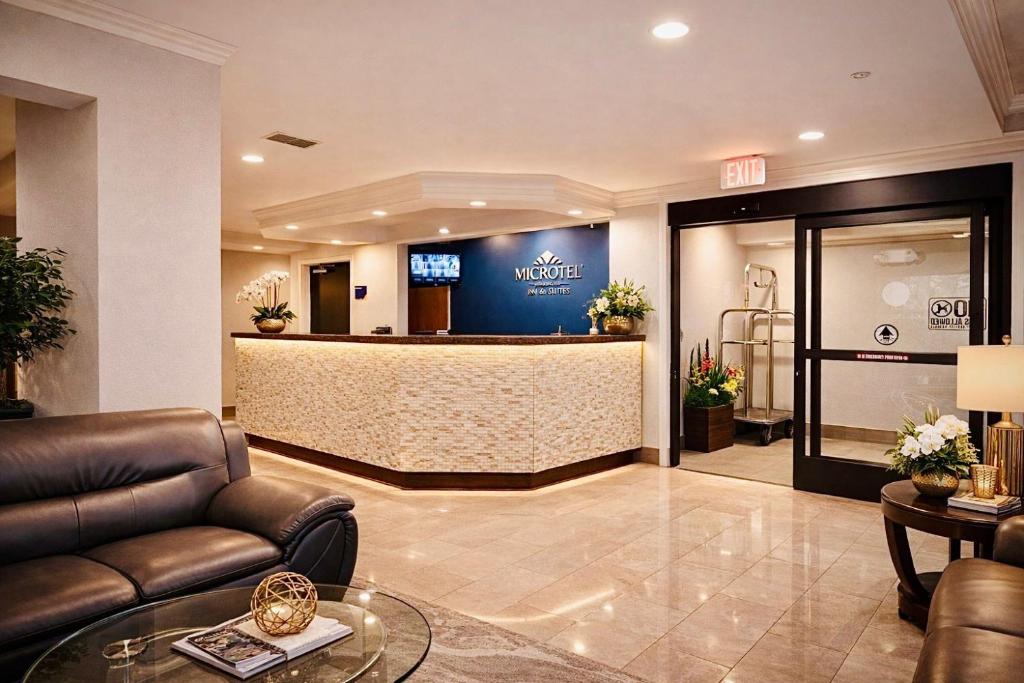 a lobby of a hotel with a waiting room at Microtel Inn by Wyndham - Murfreesboro in Murfreesboro