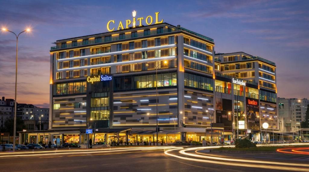 a building with a sign on top of it at Capitоl Suites & Apartments in Skopje