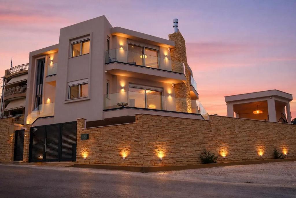 a building with lights on the side of it at Elia Luxury Residence in Chalkida