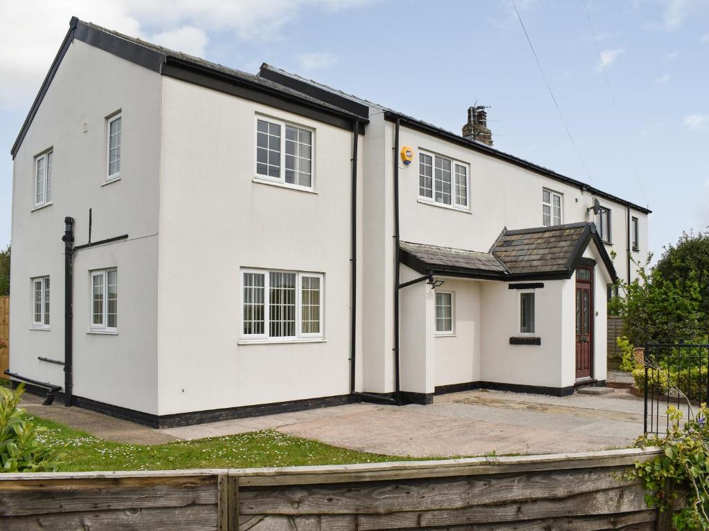 an exterior view of a white house at Bank Lane House in Freckleton