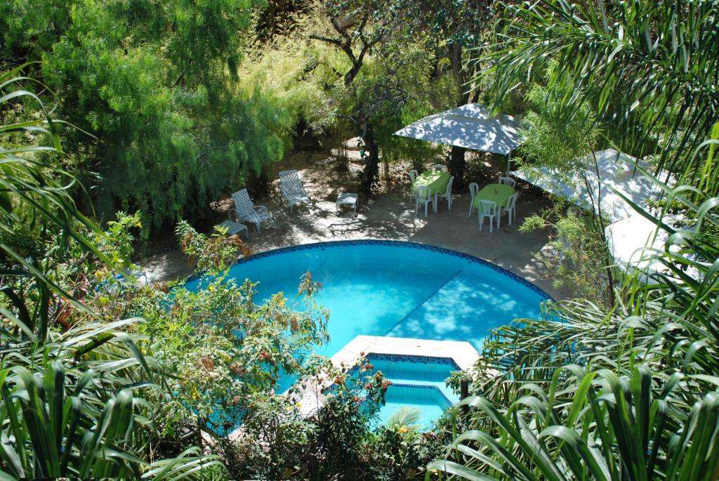 an overhead view of a swimming pool in a garden at Pousada Casa das Flores in Sao Jorge