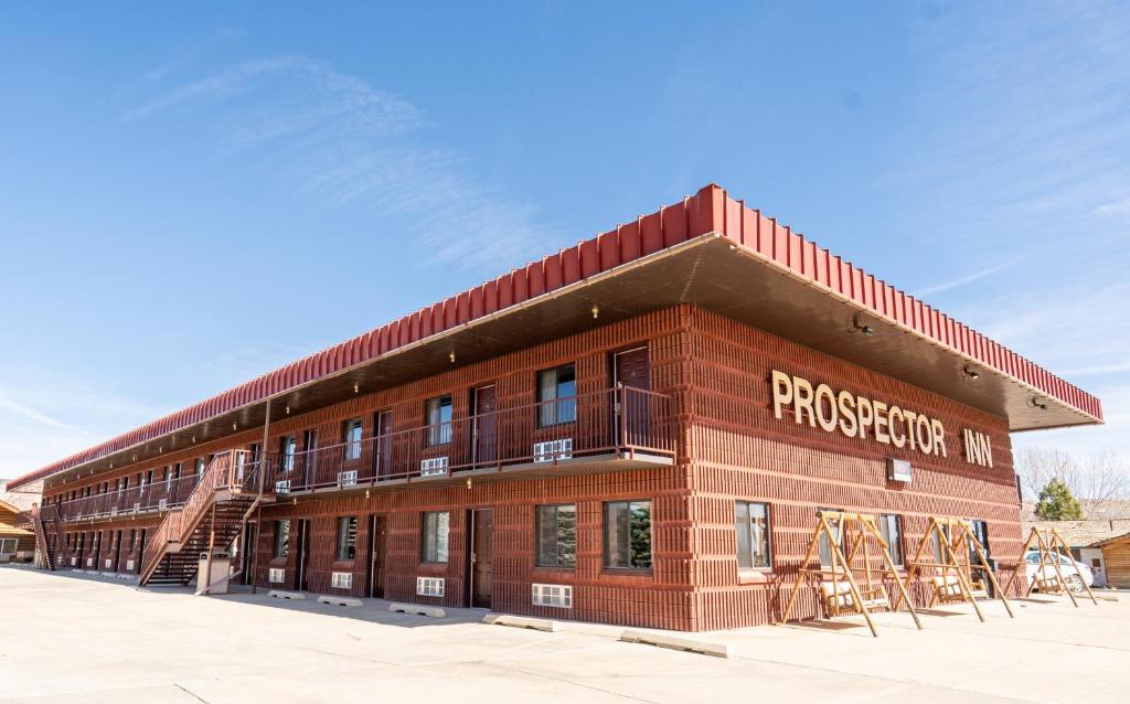 a large brick building with a fire escape at Prospector Inn in Escalante
