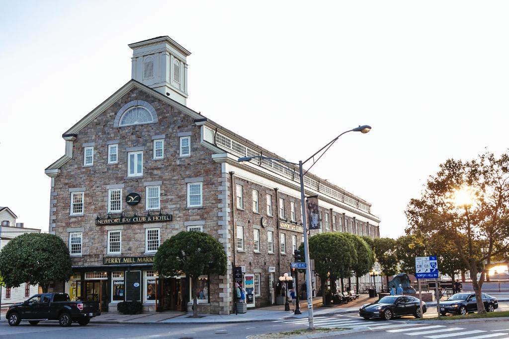 a large brick building on the corner of a street at Newport Bay Club and Hotel in Newport