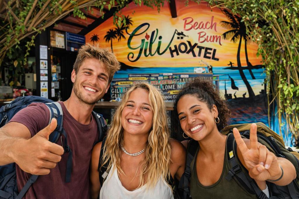 a group of three people giving the thumbs up at Gili Beach Bum Hostel in Gili Trawangan