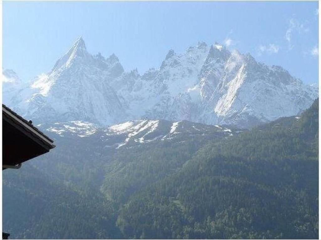 a view of a mountain range with snow capped mountains at Apartment Clos du Savoy in Chamonix-Mont-Blanc