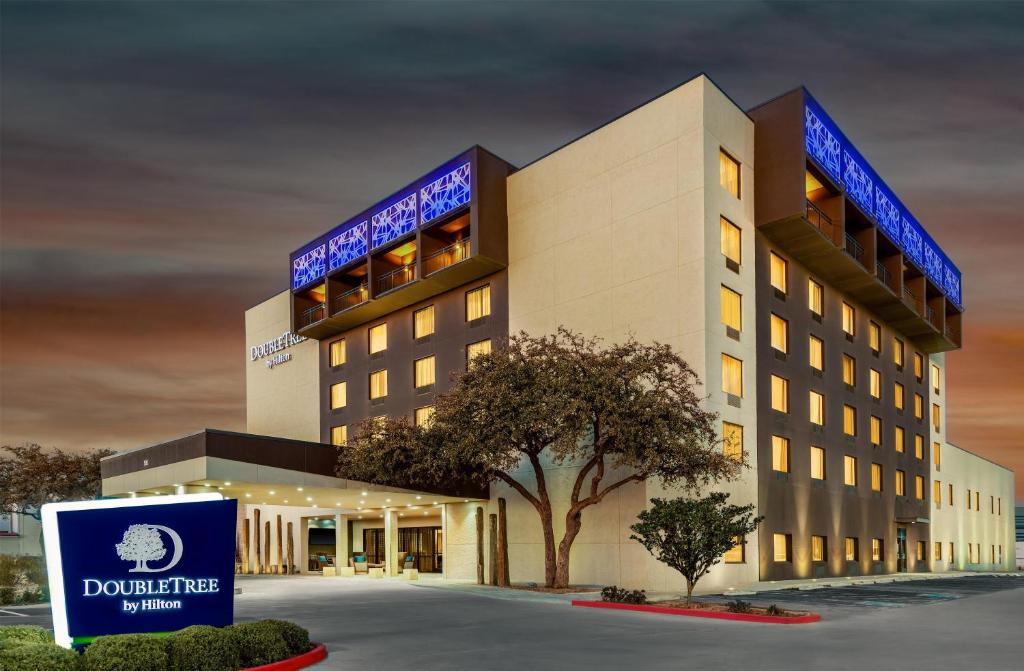 a hotel building with a sign in front of it at Doubletree By Hilton Lubbock - University Area in Lubbock