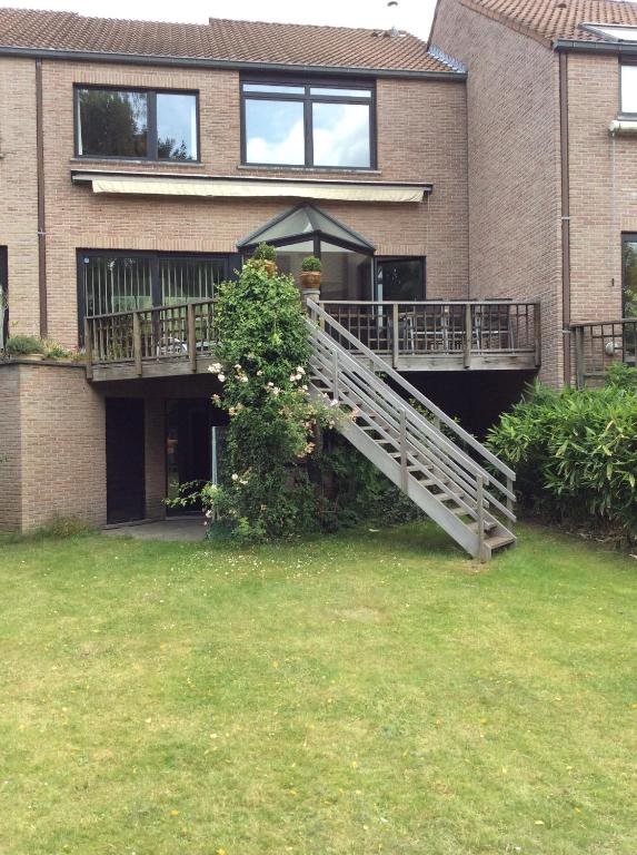 a house with a staircase on the side of it at B&B Uccle in Brussels