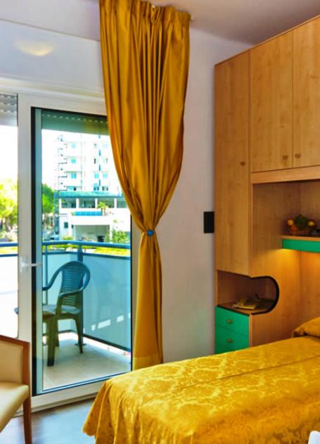 A bed or beds in a room at Hotel Gimm