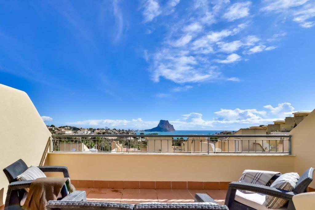 a balcony with chairs and a view of the ocean at Bungalow Montesol con Vistas al Mar y Montaña in Calpe