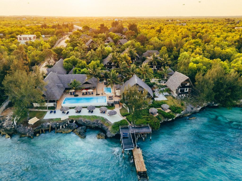 an aerial view of a house on a island in the water at Sunshine Marine Lodge in Matemwe