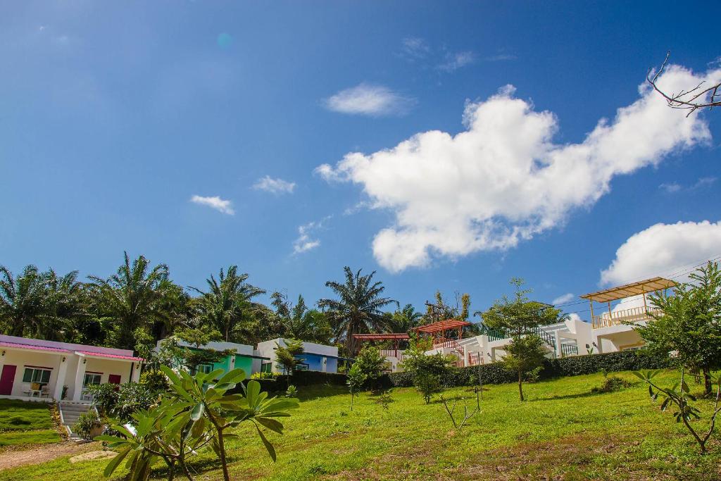 a group of houses on a hill with a blue sky at KeereeLay --- SHA Extra Plus --- in Ko Lanta