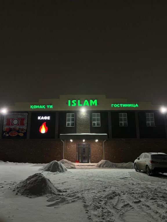 a islam store in the snow at night at Гостиница Ислам in Khromtaū