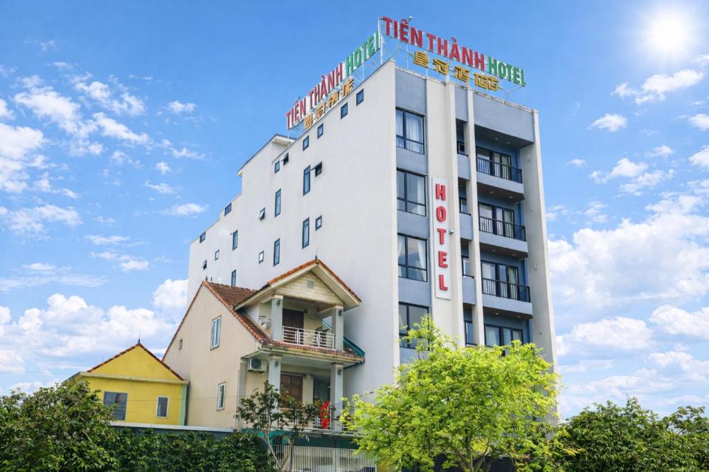 a white building with a sign on top of it at Tiến Thành Hotel Nghệ An in Vinh