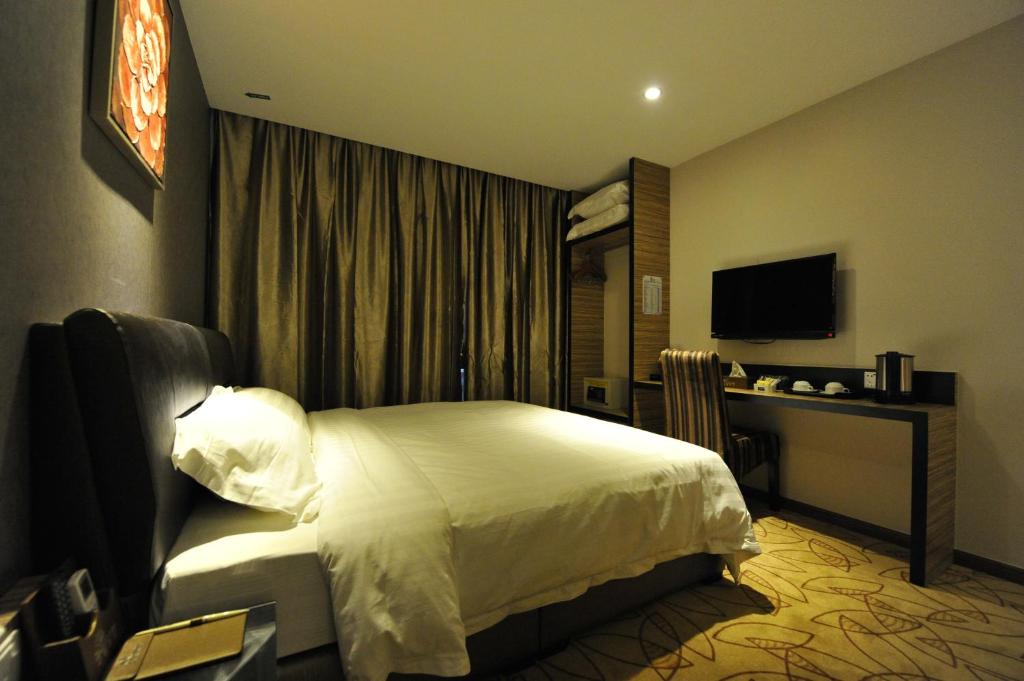 TV a/nebo společenská místnost v ubytování Milano Hotel