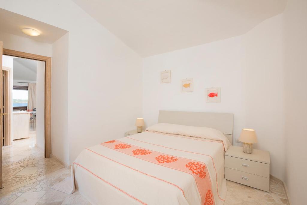 Postel nebo postele na pokoji v ubytování Le Maree Apartments