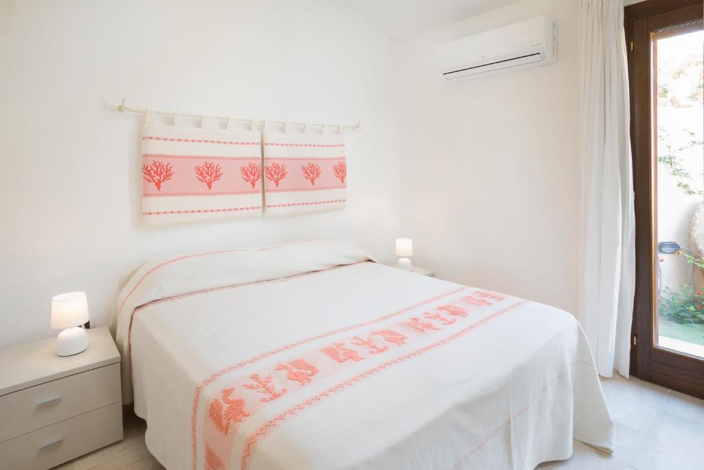 Postel nebo postele na pokoji v ubytování Le Maree Apartments