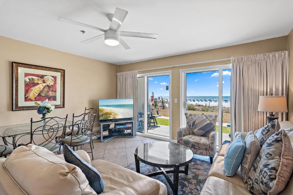 a living room with a view of the ocean at Windancer 110 in Destin