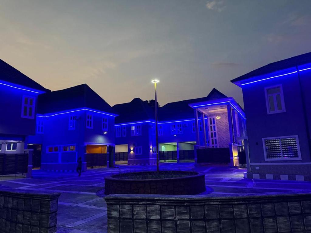 a group of houses with blue lights on them at Unique CityLife Hotel in Etoi
