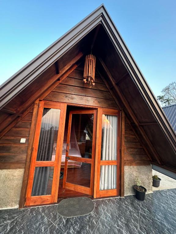 a wooden door on the front of a house at The Cliff Lodge Ella in Ella