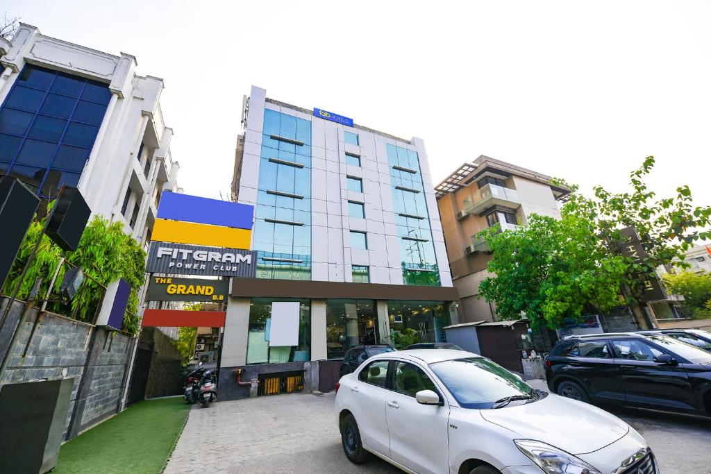 a white car parked in front of a building at FabHotel Grand Boutique in New Delhi