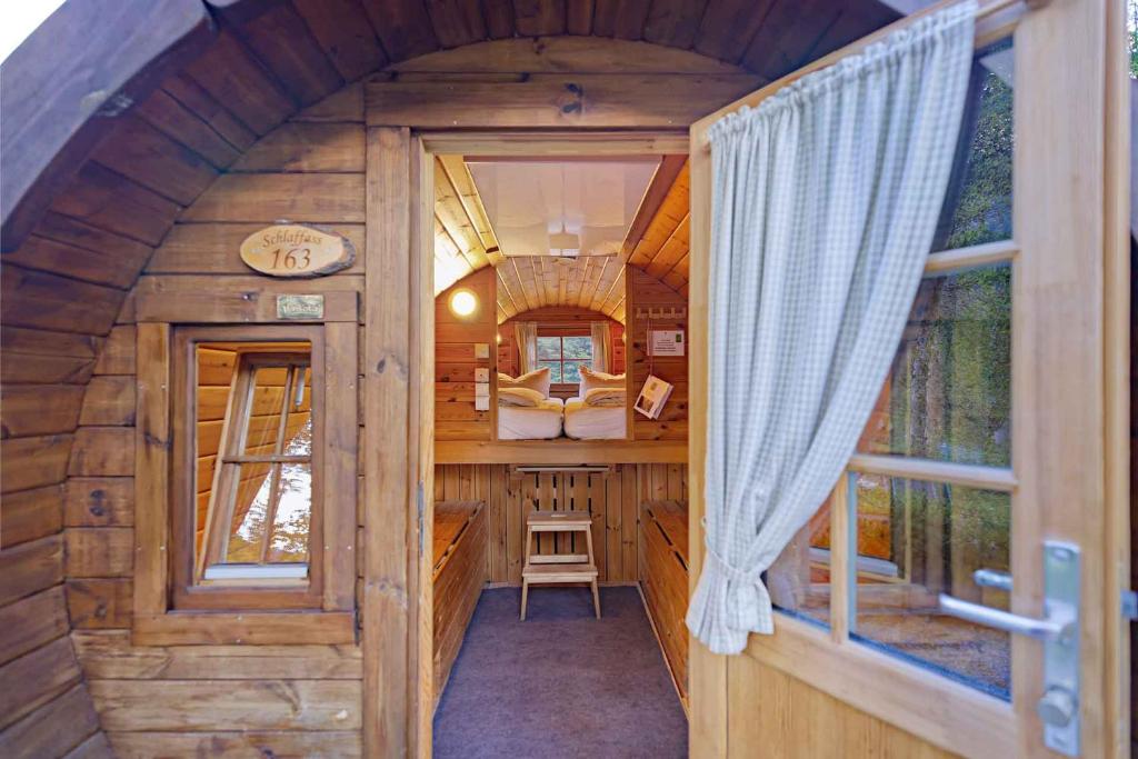 an inside view of a tree house with a window at Alpen-Schlaffass in Grainau