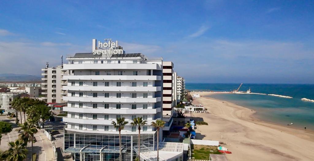 a hotel on the beach next to a beach at Sea Lion Hotel in Montesilvano
