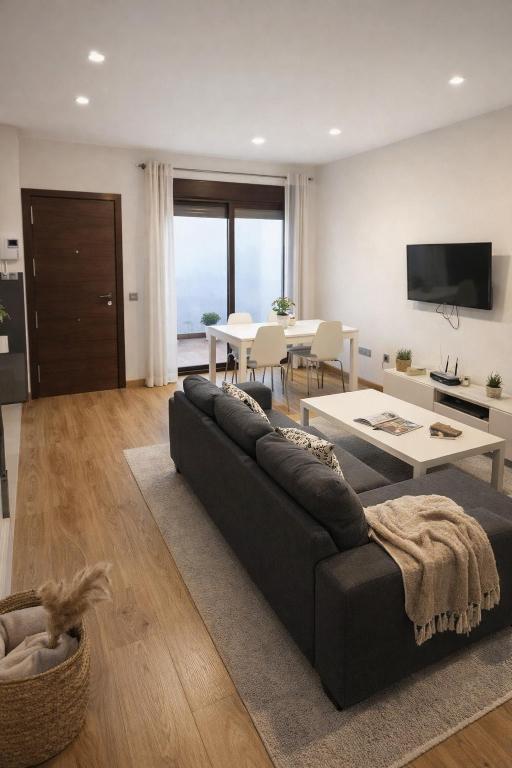 a living room with a couch and a table at Gav Remedios 20 in Ronda
