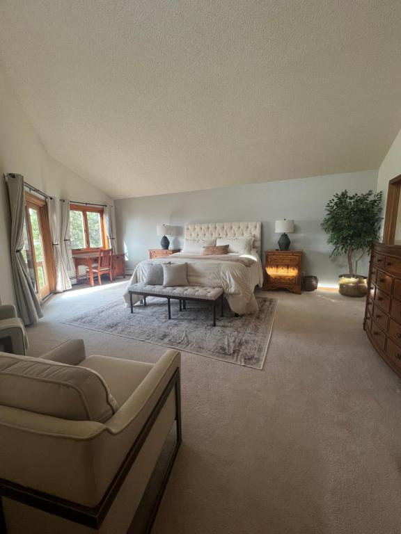 a large bedroom with a bed and a fireplace at Bayou Hills BnB in Parker