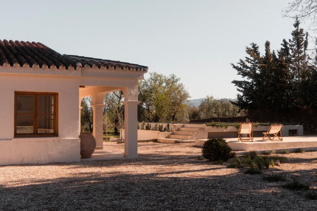 a house with two chairs and a patio at Casa Valentina Ronda in Ronda