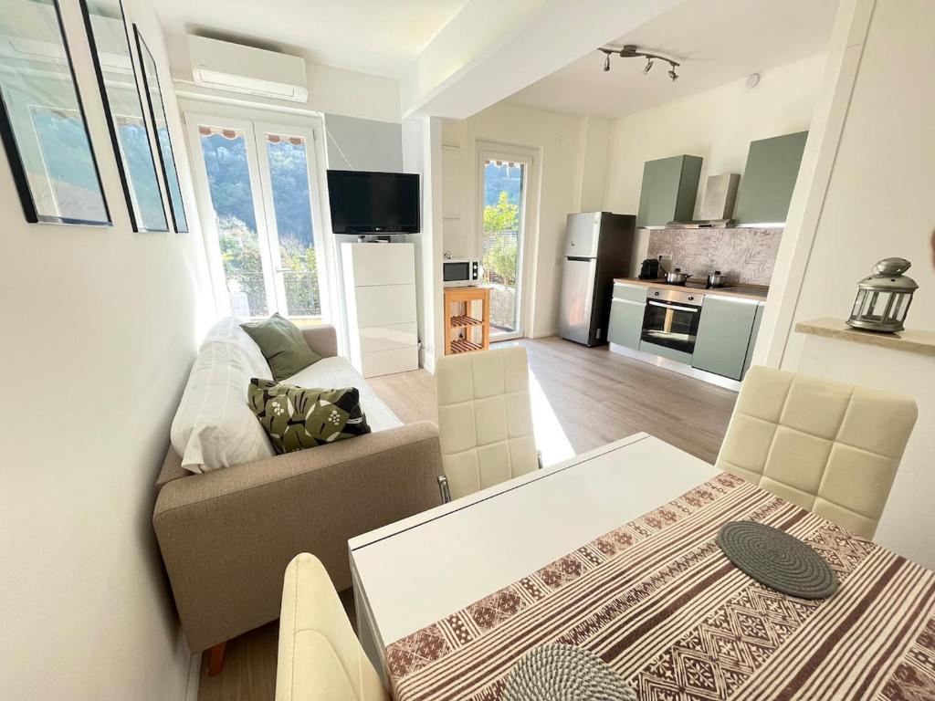 a living room with a couch and a table at Casa Leone sea&terrace in Bogliasco