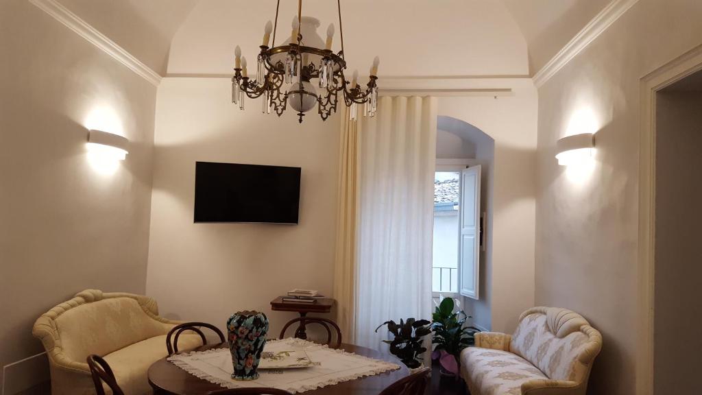 TV a/nebo společenská místnost v ubytování Epoca - Camere con stile