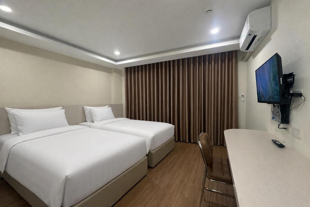 Pinotel Prachuap - โรงแรมพิโนเทล ประจวบ - Tweepersoonskamer Met 2 Aparte Bedden En Balkon