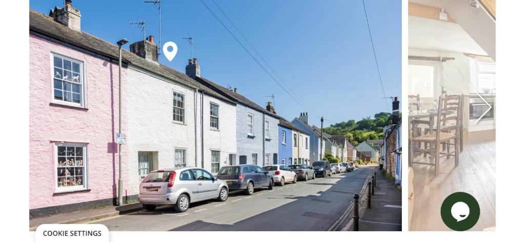 a row of cars parked on the side of a street at Snowdrop Cottage in Totnes