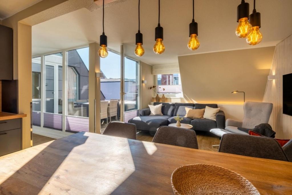 a living room with a couch and a table at Wohnung K13 in Borkum