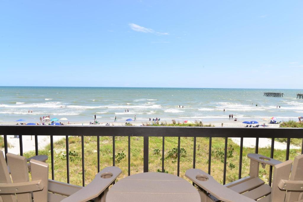 a view of the beach from the balcony of a condo at Direct Oceanfront Magic at Sea Marsh w Pool in Myrtle Beach