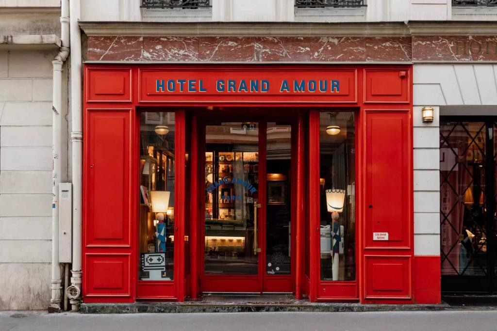 a red hotel grand a couture store front at Hôtel Grand Amour in Paris