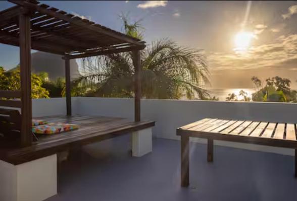 a wooden bench sitting on top of a balcony at Authentic Nest in La Gaulette