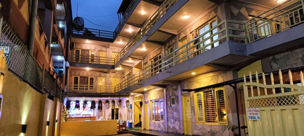 a building with balconies on the side of it at Hotel Lake shadow inn in Pokhara